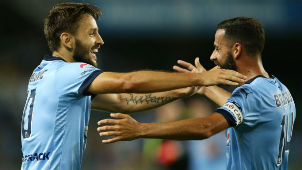 Milos Ninkovic and Alex Brosque celebrate a goal against Brisbane on Friday night.