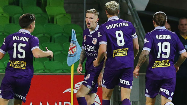Perth Glory players celebrate one of Andy Keogh's goals against City on Friday night.