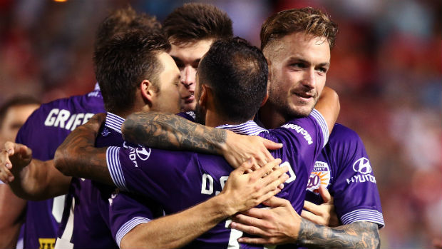 Perth Glory players celebrate one of their five goals against Adelaide on Friday night.