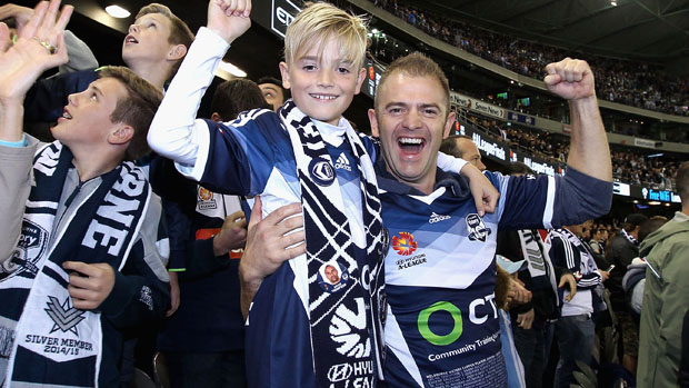 A young Victory fan with his father at the 2014/15 semi-final against Melbourne City.