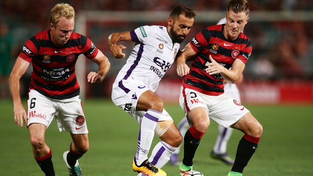 Glory marquee Diego Castro fights for the ball with Wanderers duo Mitch Nichols and Scott Jamieson.